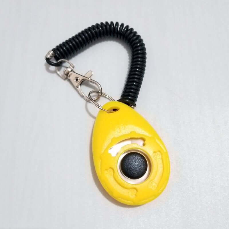 Yellow Dog Training Clicker with spiral wrist strap for effective pet obedience training