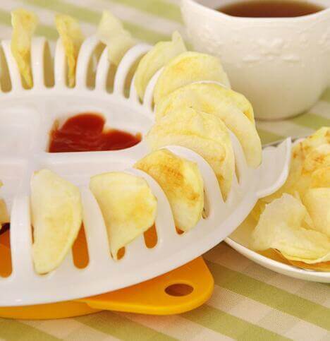 Potato Chips Maker plastic kitchen gadget for healthy homemade chips with potato tray, stander, and slicer on a table.