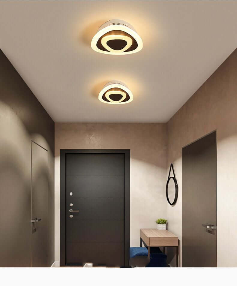 Surface-Mounted Ceiling Lamp illuminating modern hallway with sleek, minimalist design & soft LED lighting for home elegance.