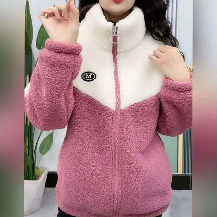 Woman wearing Fashionable Warm Women's Casual Jacket in pink and white, high-quality polyester fabric ideal for cold weather.