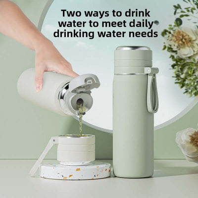 Large Capacity Stainless Steel Water Bottle with premium design and tea separation, shown on a stylish countertop.