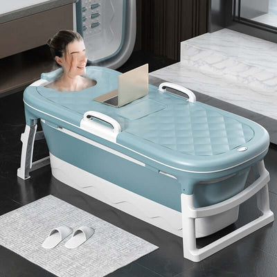 Foldable Plastic Bathtub in use, portable and durable for home or travel, blue design with laptop stand for added convenience