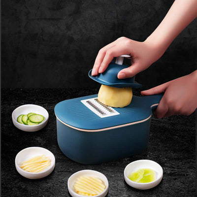 Person using Vegetable Cutter & Slicer for slicing vegetables with bowls of sliced produce around it.