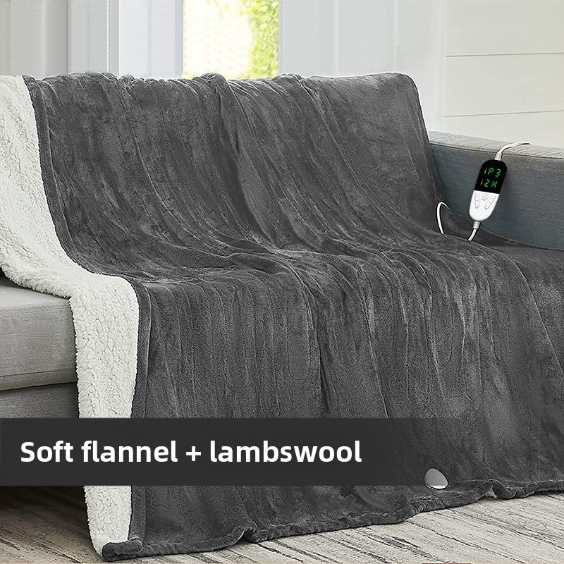 Flannel Electric Blanket on sofa with 24 temperature settings, featuring soft flannel and lambswool design.