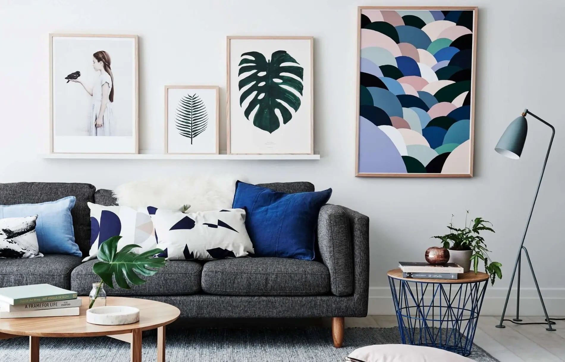 Living room with gray sofa, decorative pillows, and wall art - DoubleJoy Store