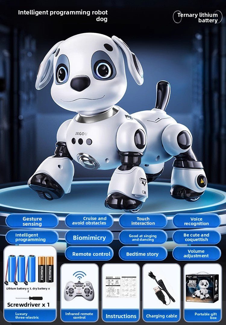 White and black intelligent robot dog toy with remote control, batteries, and charging cable.