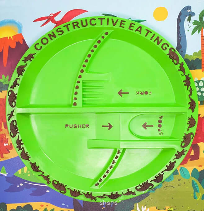 Kids Cutlery Set – Fun & Safe Utensil for Toddlers on a green colorful dinosaur-themed placemat.