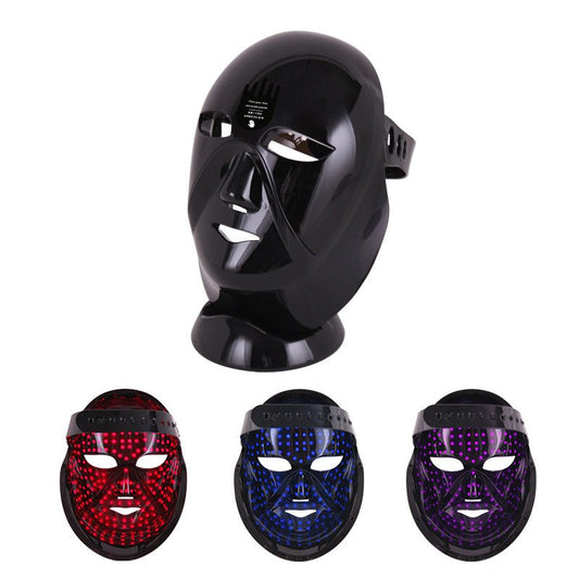 Black LED phototherapy acne removal mask shown in three light modes: red, blue, and purple.