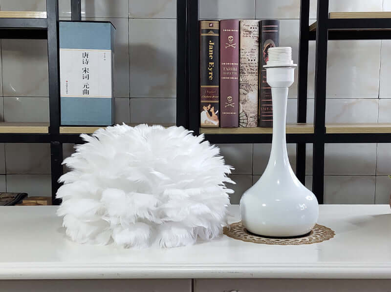 Luxury Feather Table Lamp with white goose feather lampshade on a modern base, perfect for bedroom and living room décor.