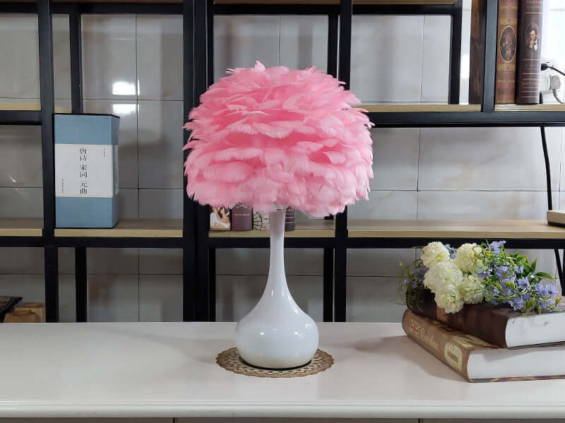 Luxury Feather Table Lamp with pink goose feather shade on white base, perfect for bedroom or living room ambiance.