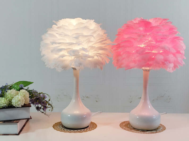 Luxury Feather Table Lamp with white and pink feather shades on bedside table.