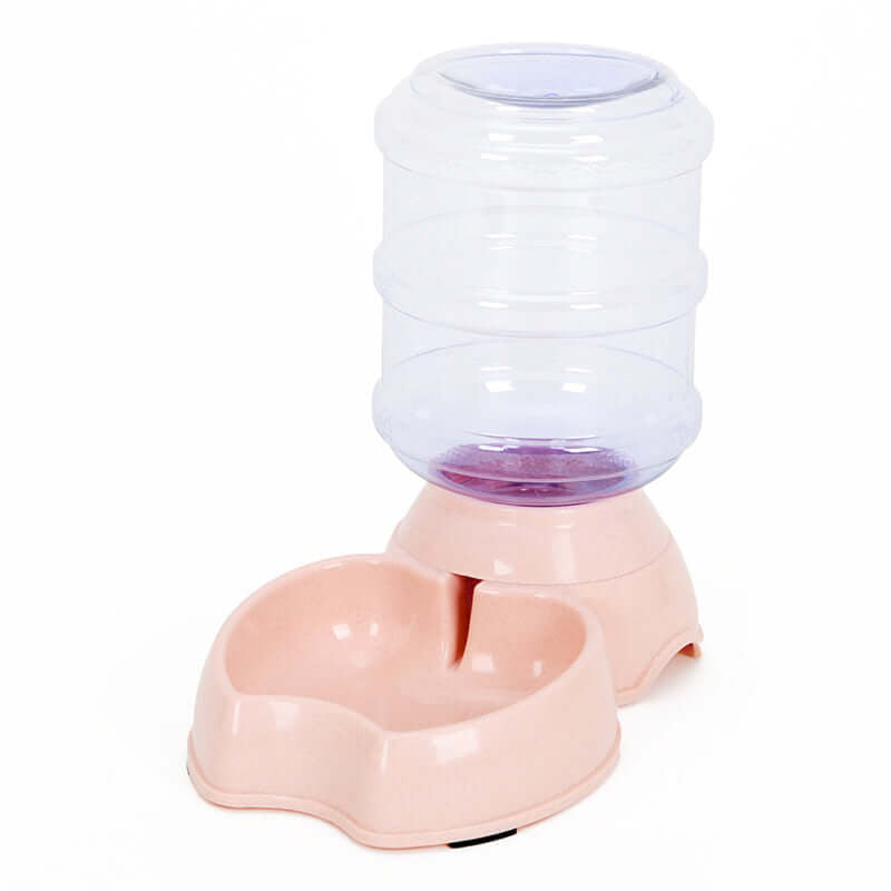Automatic pet water dispenser with a clear reservoir and pink base, for keeping your pet hydrated & complementing your setup.