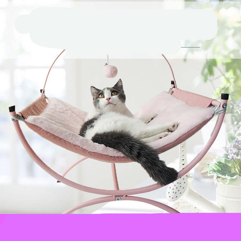 Cat lounging on Universal Cat Recliner Bed in pink for all-year comfort