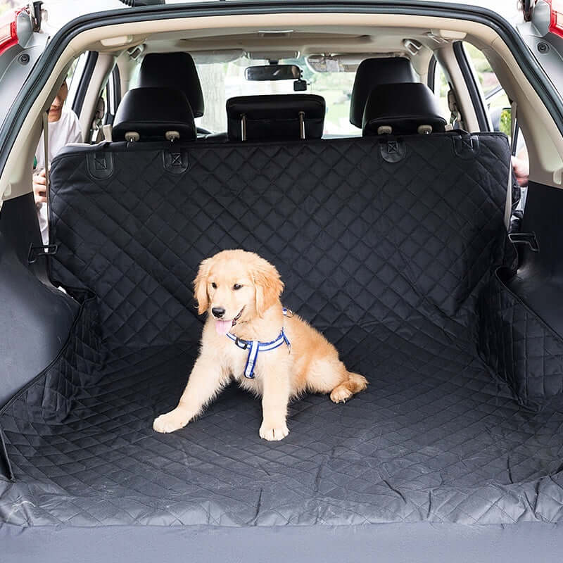 Golden retriever sitting on Waterproof Pet Car Seat Cushion in rear travel mat setup with toilet function, for pet travel.